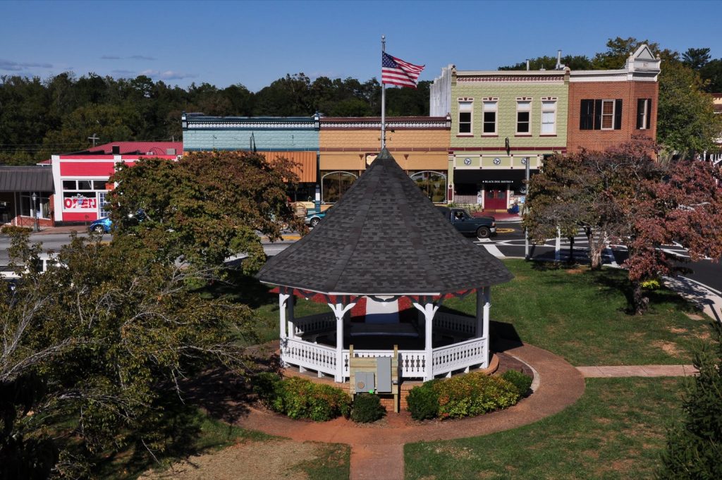 Gazebo in town square with flag on roof